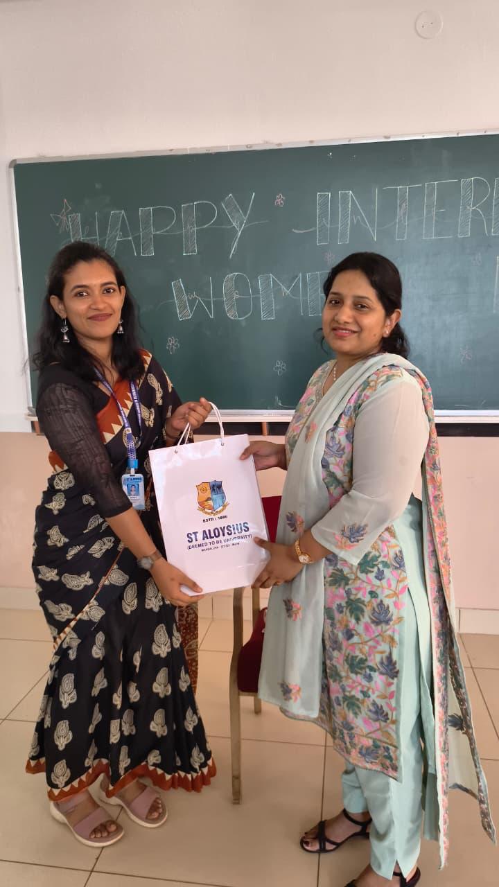 Dr. Shannon receiving gift at St. Aloysius Women's Day